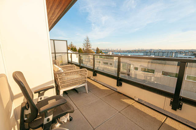 Furnished balcony with city view and modern furniture. - 30 - 533 East 3rd st., North Vancouver