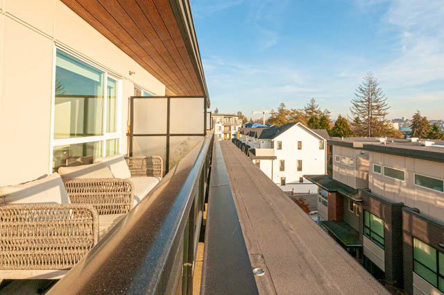 Furnished balcony with outdoor furniture and city view. - 30 - 533 East 3rd st., North Vancouver