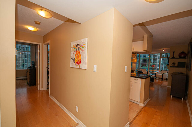 Spacious open-concept living with hardwood floors, modern kitchen, and city view. - 1605 - 1199 Marinaside Crescent, Vancouver Downtown