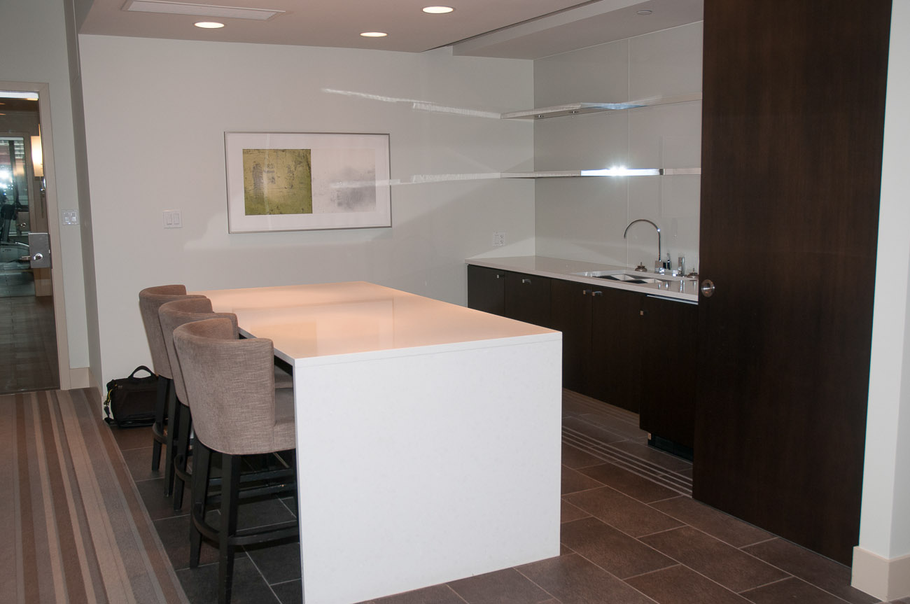 Bright kitchen with white island, dark wood cabinets, and modern decor. - 3501 - 1028 Barclay, Vancouver Downtown
