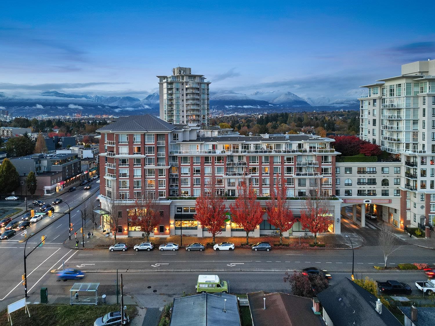 Spacious balcony overlooking city mountains and vibrant red maple trees. - 807 - 4078 Knight Street, Vancouver East Side