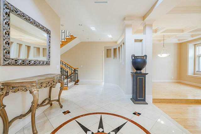 Elegant entryway with marble flooring and ornate console table. - 1128 W 49th, Vancouver West Side
