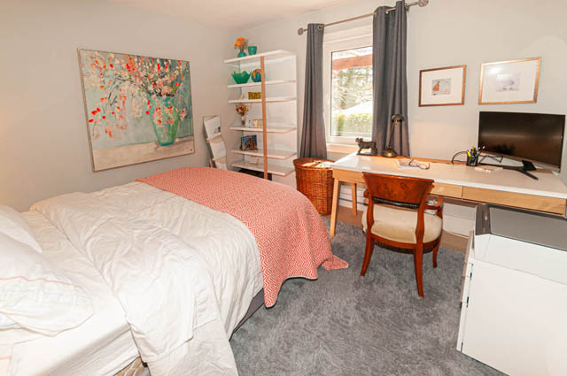Spacious bedroom with a cozy bed, desk, and large window. - 2128 Grand Blvd, North Vancouver