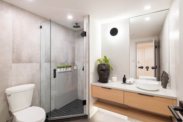 Furnished bathroom with modern fixtures and a large mirror. - 1402 - 738 Broughton St, Vancouver Downtown