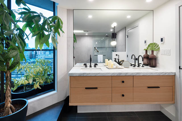 Furnished bathroom with marble countertops, modern fixtures, and a city view. - 1402 - 738 Broughton St, Vancouver Downtown