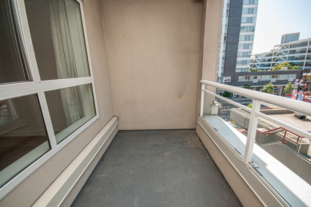Spacious balcony with modern railings and city views. - 313 - 108 West Esplanade Ave, North Vancouver