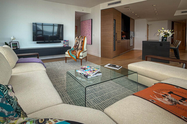 Modern living room with hardwood floors, a glass coffee table, and a city view. - WITHHELD, Vancouver Downtown
