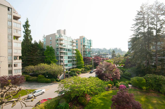 Spacious 2-bedroom condo with modern furnishings and a serene garden view. - 404 - 1480 Duchess Ave, West Vancouver