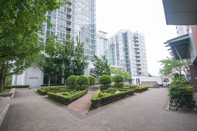 Furnished living room with modern decor and city view. - 1105 - 198 Aquarius Mews, Vancouver Downtown