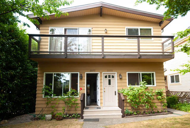Furnished 2-bedroom duplex with a cozy balcony and lush greenery. - 2077 W 13th Ave, Vancouver West Side