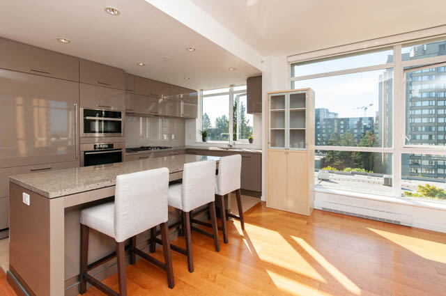 Bright kitchen with granite countertops, hardwood floors, and a city view. - 903 - 5989 Walter Gage Rd, Vancouver West Side