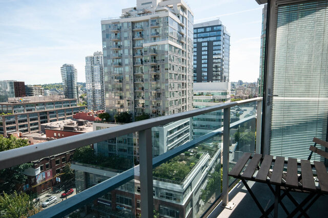 Balcony with city view and modern furnishings, perfect for downtown living. - 1601 - 788 Hamilton Street, Vancouver Downtown