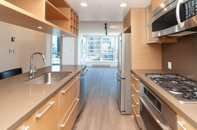 Bright kitchen with modern stainless steel appliances and city view. - 1102-833 Seymour Street, Vancouver Downtown