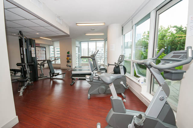 Bright and spacious gym with large windows, hardwood floors, and exercise equipment. - 1102-833 Seymour Street, Vancouver Downtown