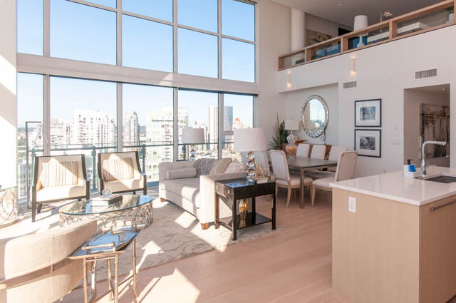 Spacious penthouse living room with hardwood floors, city view, and modern furnishings. - 2818  - 89 Nelson Street, Vancouver Downtown