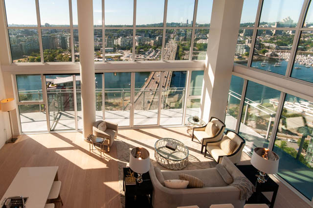 Spacious penthouse living room with hardwood floors, a large city view, and modern furnishings. - 2818  - 89 Nelson Street, Vancouver Downtown