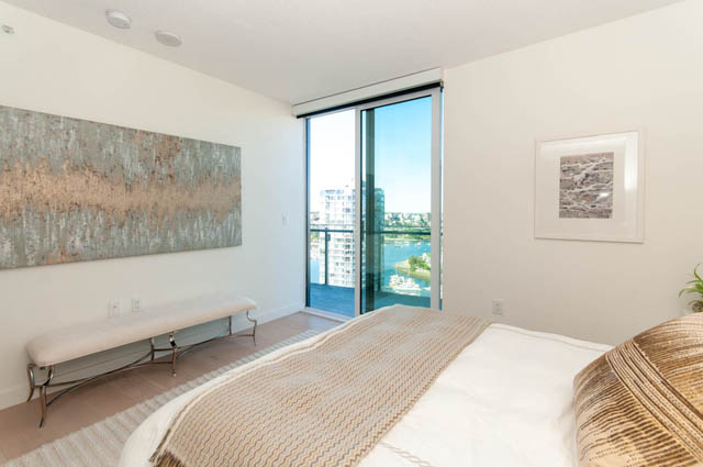 Spacious penthouse bedroom with a stunning city view and modern decor. - 2818  - 89 Nelson Street, Vancouver Downtown