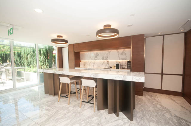 Modern kitchen with marble countertops and sleek pendant lights. - 2818  - 89 Nelson Street, Vancouver Downtown