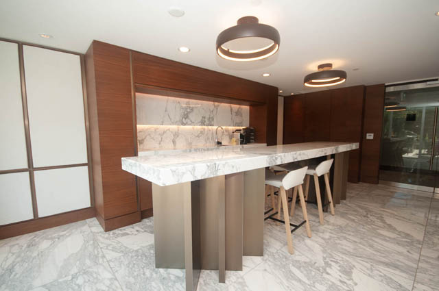 Modern kitchen with marble countertops and sleek wooden cabinetry. - 2818  - 89 Nelson Street, Vancouver Downtown