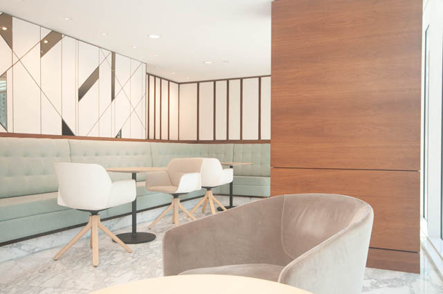 Spacious lounge with modern furniture, marble flooring, and geometric wall paneling. - 2818  - 89 Nelson Street, Vancouver Downtown