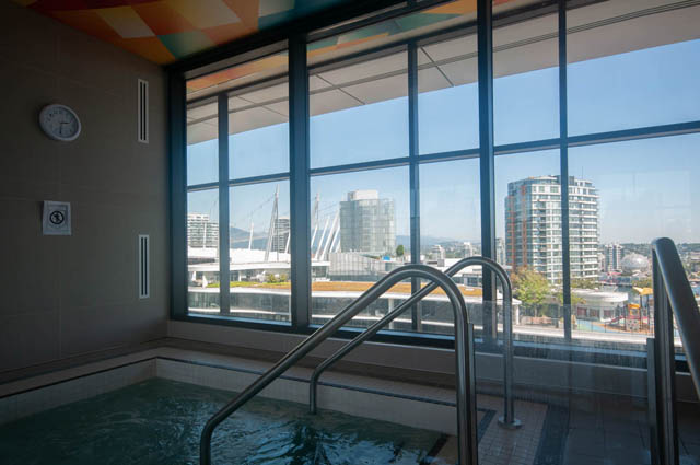 Spacious penthouse with a stunning city view from the large window, featuring a modern indoor pool. - 2818  - 89 Nelson Street, Vancouver Downtown