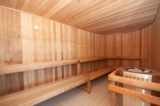 Spacious, well-lit penthouse sauna with wooden benches and tiled floor. - 2818  - 89 Nelson Street, Vancouver Downtown