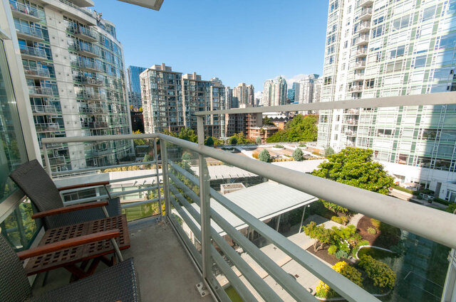 Furnished balcony with city view and modern furnishings. - 905 - 1199 Marinaside Cres., Vancouver Downtown