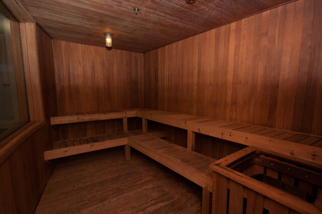 Spacious, cozy sauna with wooden benches and walls, perfect for relaxation. - 905 - 1199 Marinaside Cres., Vancouver Downtown