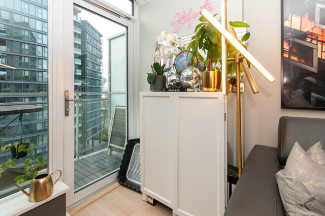Spacious living room with modern decor, city view, and stylish furniture. - 1006 -1618 Quebec Street, Vancouver East Side