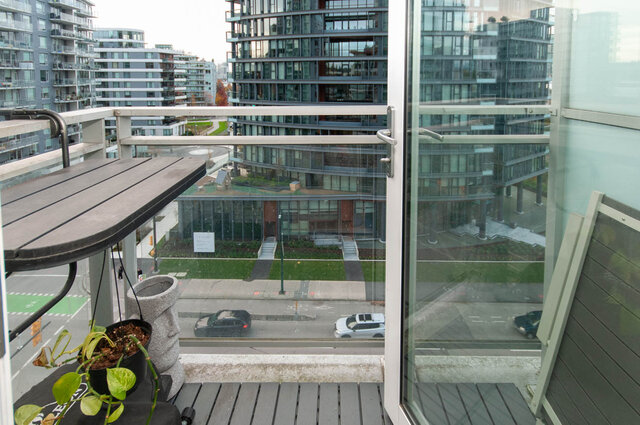 Furnished balcony with city view and modern condo architecture. - 1006 -1618 Quebec Street, Vancouver East Side