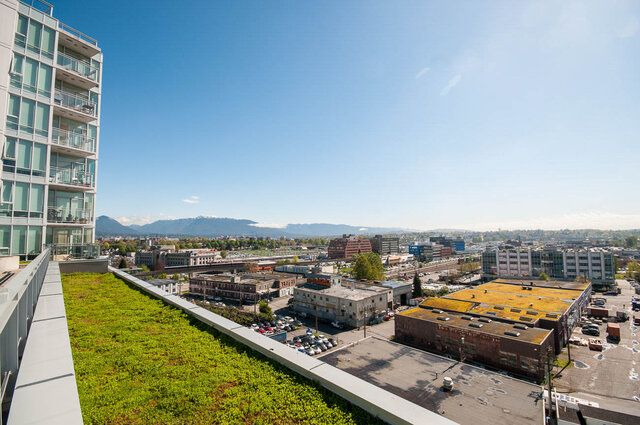 Bright living room with a stunning city view and green rooftop garden. - 1006 -1618 Quebec Street, Vancouver East Side