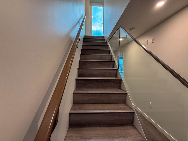 Staircase leading to upper level with wooden steps and glass railing, modern design. - TH 13 - 2030 East 20th Ave, Vancouver East Side