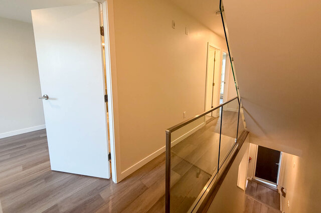 Staircase leading to upper level with hardwood floors and modern railings. - TH 46- 2050 East 20th Ave, Vancouver East Side