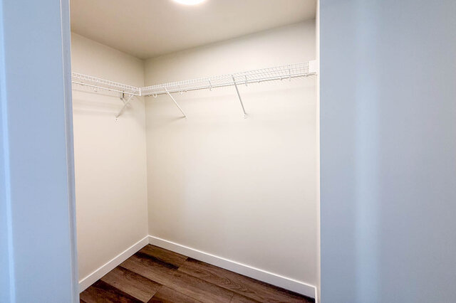 Spacious walk-in closet with white shelving and hardwood flooring. - TH 46- 2050 East 20th Ave, Vancouver East Side