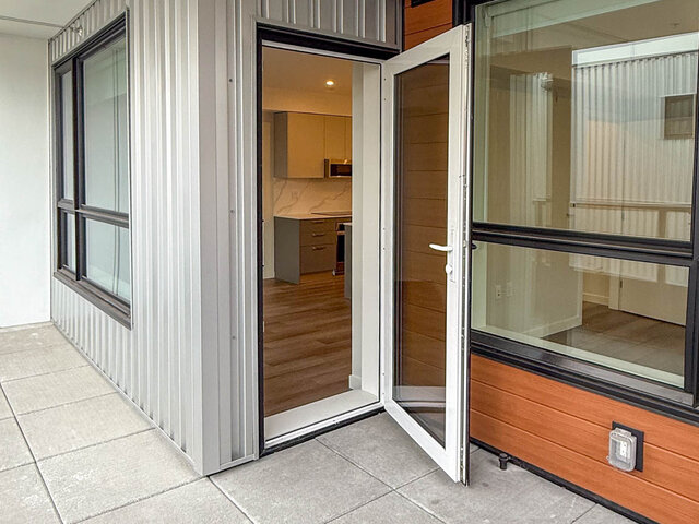 Balcony door open to the kitchen - 302-3588 Hull St, Vancouver East Side
