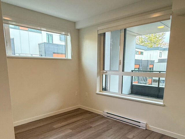 Empty room with two windows on the corner - 302-3588 Hull St, Vancouver East Side