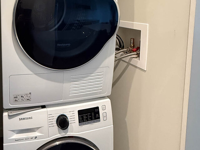 Stacked full-size washer and heat pump dryer in the unit - 302-3588 Hull St, Vancouver East Side