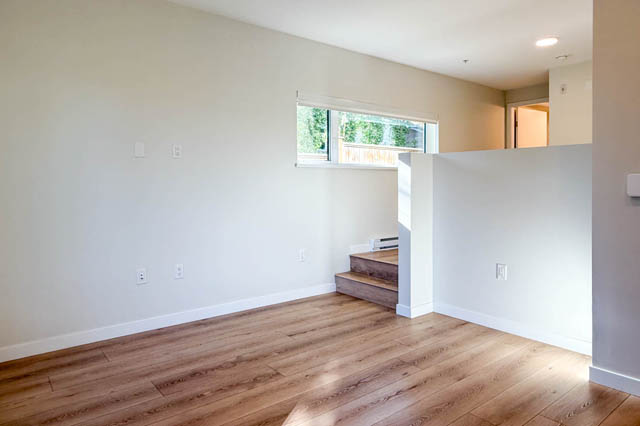 Bright living room with hardwood floors and a window view. - G 22 - 2070 East 20th Ave, Vancouver East Side