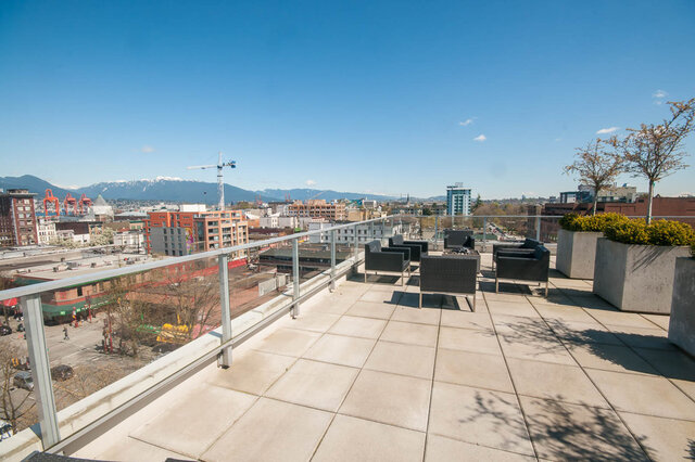 The balcony features outdoor seating, planters with greenery, and a city and mountain view. - 812-189 Keefer Street, Vancouver Downtown