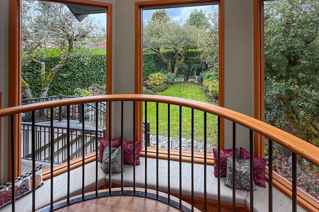 Spacious balcony overlooking lush garden with vibrant flowers and mature trees. - 3850 Point Grey Road, Vancouver West Side