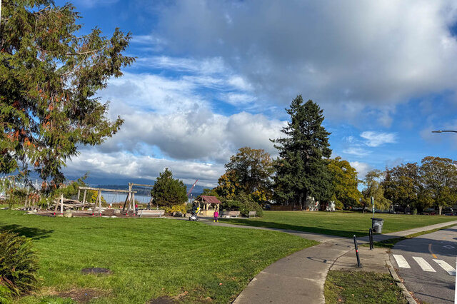 Spacious outdoor living area with lush greenery and a scenic city view. - 3850 Point Grey Road, Vancouver West Side