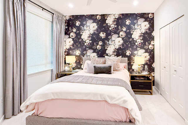 Spacious 1-bedroom + den with floral wallpaper, modern furnishings, and a cozy bed setup. - 526-119 West 22nd Street, North Vancouver