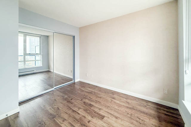 Spacious den with hardwood floors and sliding glass doors leading to a balcony. - 1011- 939 Expo Blvd., Vancouver Downtown