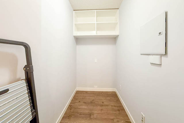 Den with hardwood floors and built-in shelving. - 1011- 939 Expo Blvd., Vancouver Downtown