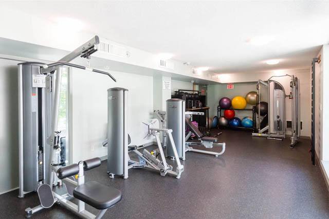 Spacious fitness room with weight machines and colorful exercise balls. - 1011- 939 Expo Blvd., Vancouver Downtown