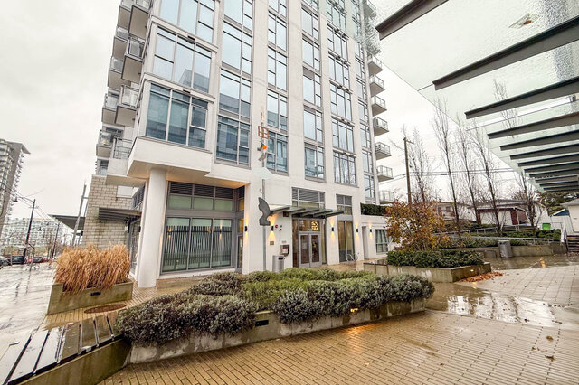 Spacious 1-bedroom + den condo with modern furnishings and a cozy outdoor garden area. - 407-2435 Kingsway, Vancouver East Side