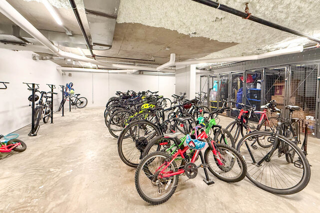 Secure bike storage with multiple racks and organized parking for residents. - 407-2435 Kingsway, Vancouver East Side