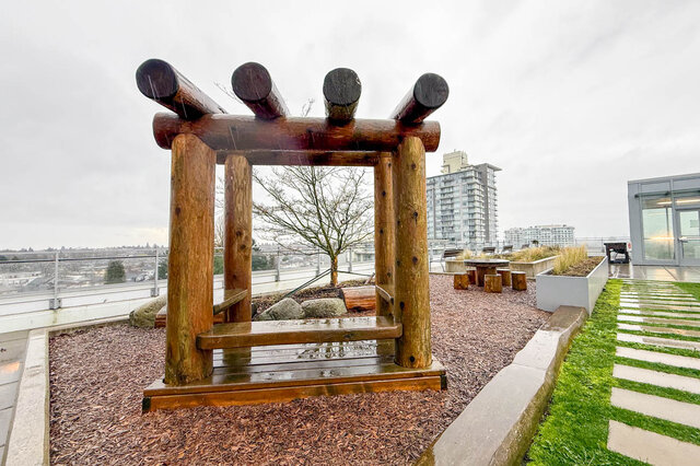 Furnished rooftop patio with wooden pergola and city view. - 407-2435 Kingsway, Vancouver East Side
