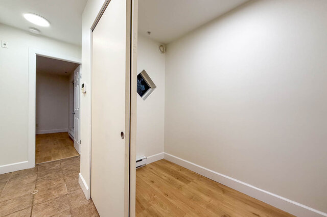 Spacious den with hardwood floors and a cozy corner, perfect for relaxation. - 304-3637 West 17th Ave, Vancouver West Side