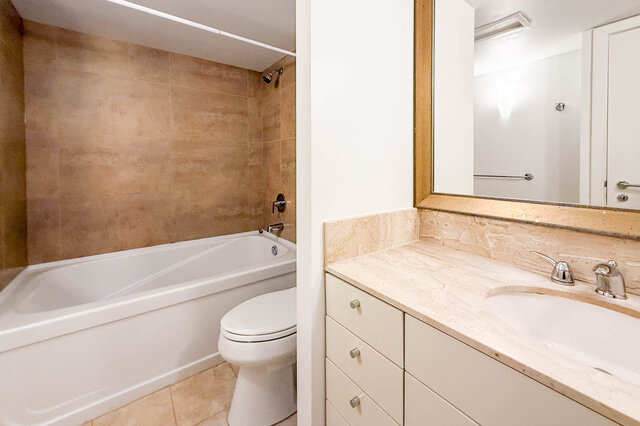 Spacious bathroom with marble countertops and a large bathtub. - 706-499 Broughton, Vancouver Downtown